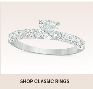 Shop classic rings with the shopping link. The image shows a diamond ring with diamonds on the band.