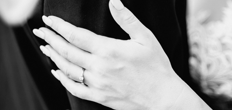 engagement ring holding hands