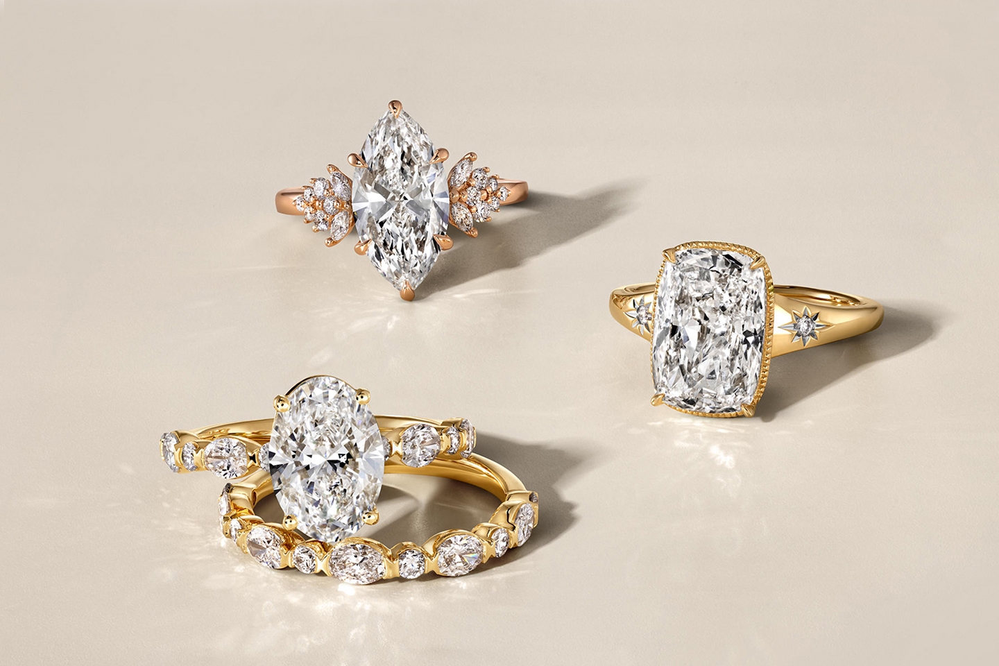 Three sparkling gold, diamond rings cut in various shapes from the Ethereal Romance collection.
