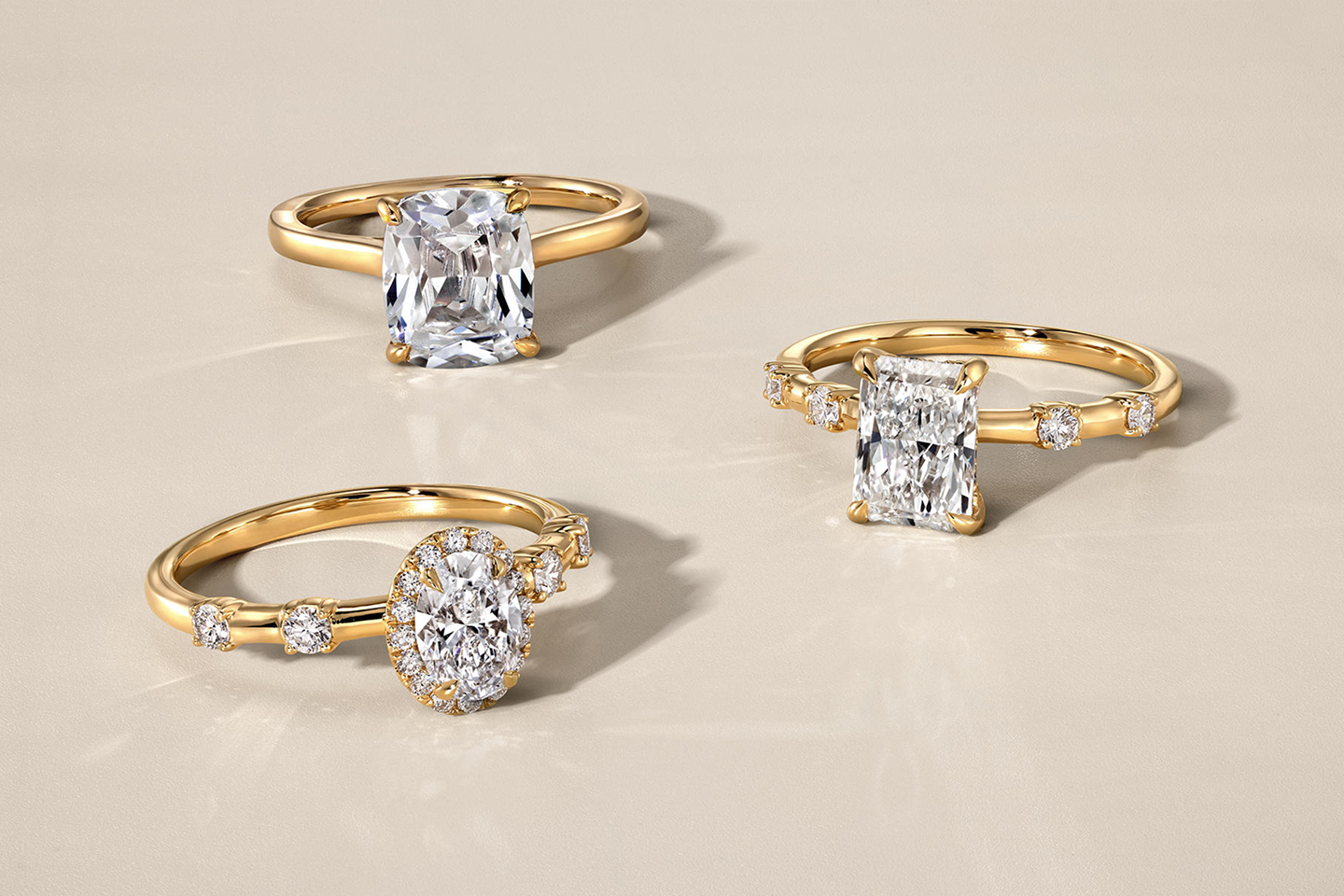 Three gold, and diamond rings in different cuts from the Modern Muse Collection.