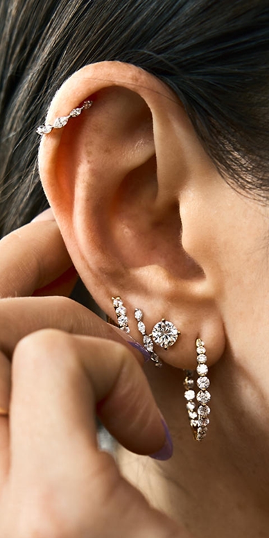1/4 CT. T.W. Marquise-Cut Lab-Grown Marquise Diamond Hoop Earrings in 10K Gold, 1/2 CT. T.W. Certified Lab-Grown Diamond Solitaire Stud Earrings in 14K White Gold, and a 2 CT. T.W. Lab-Grown Diamond Inside-Out Hoop Earrings in 10K White Gold