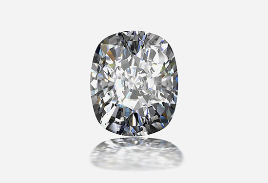 A round cut diamond on a gray background