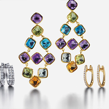 Three sets of earrings demonstrating different styles, metals and gemstones