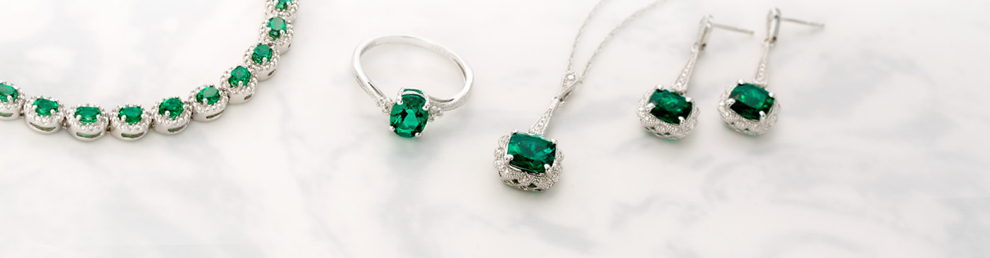 Various pieces of emerald jewelry.